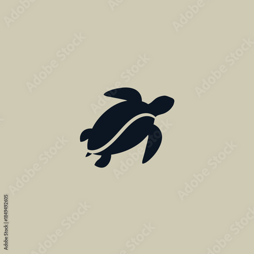 Clean, stylized graphic of a dark sea turtle, embodying tranquil marine life and ocean preservation