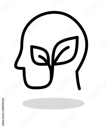 Human head profile silhouette with a growing green plant leaf inside, symbolizing mental health, personal growth, and eco-friendly mindset