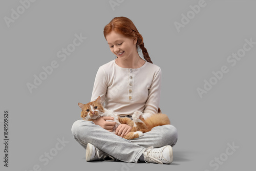 Redhead teenage girl with c...