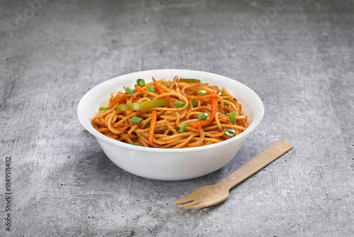 Noodles  Bowl, on a grey textured background. 