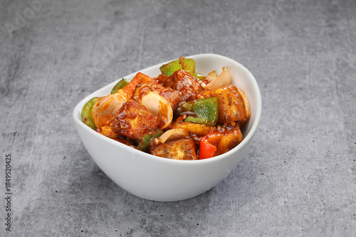 Chilli Paneer in  a bowl 