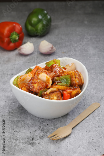 Chilli Paneer in  a bowl 
