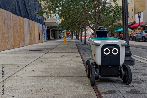 Autonomous delivery robot on city sidewalk in the United States