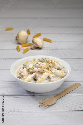 white sauce pasta on a grey base 