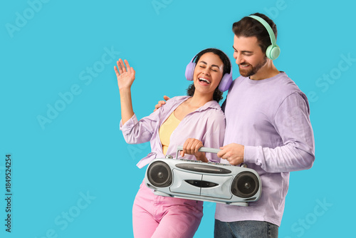 Young couple in headphones ...