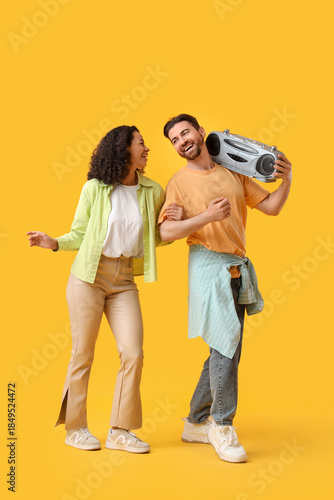 Young couple with boombox o...