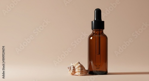 Amber dropper bottle with seashell.