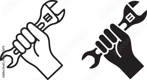 Hands holding wrenches