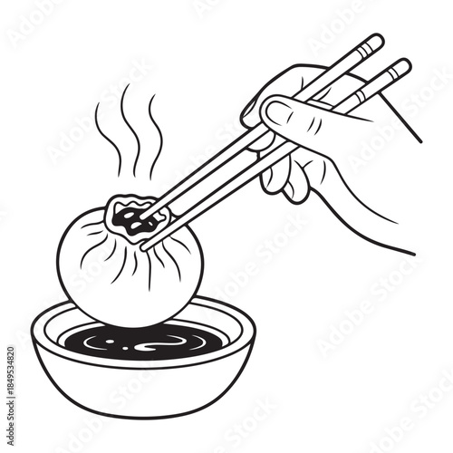 Dipping dumpling in sauce