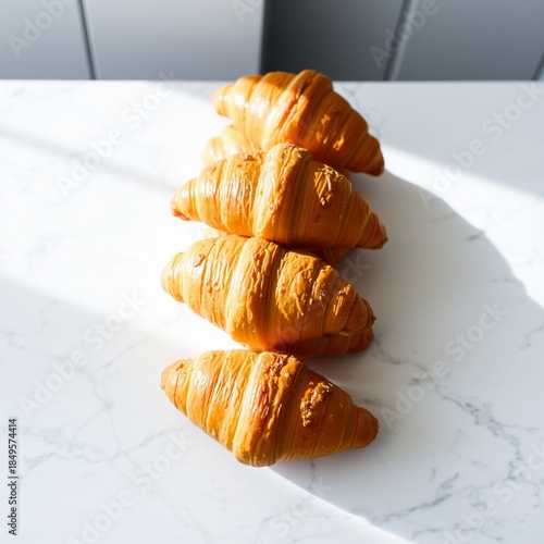 Five croissants vector illustration arranged in vertical line on white marble kitchen background with natural light