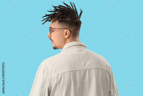 Young man with dreadlocks a...