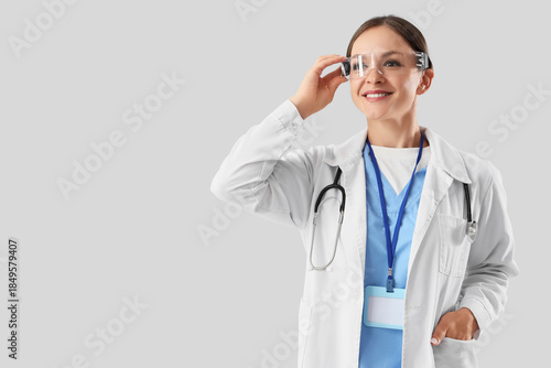 Female doctor in goggles on...