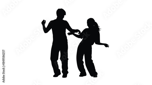 Silhouette of a young man and woman dancing energetically together in a dynamic pose