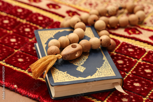 Koran with prayer beads and...