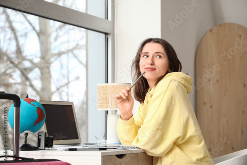 Thoughtful female traveler ...