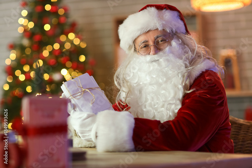 Santa Claus with letters at...