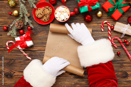 Santa hands with blank scro...