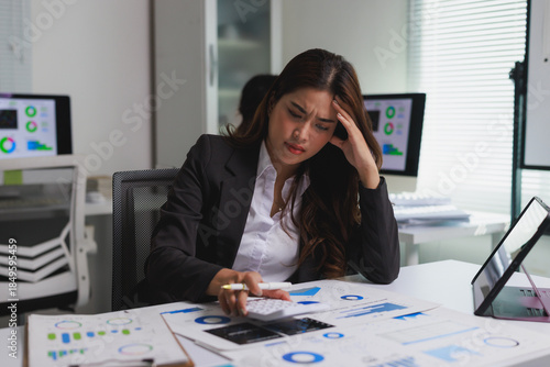 Quadro su tela Stressed businesswoman calculating expenses facing financial problems