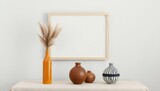 Minimalist home decor with dried grass ceramic vases and empty frame