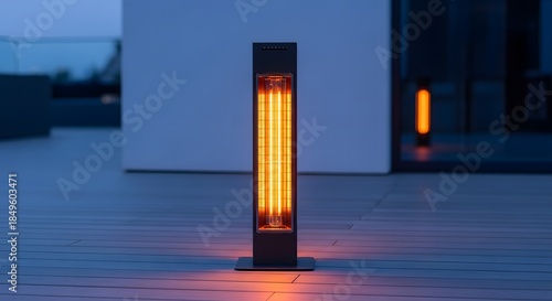 Modern electric outdoor patio heater glowing brightly on a wooden deck at twilight, providing warmth