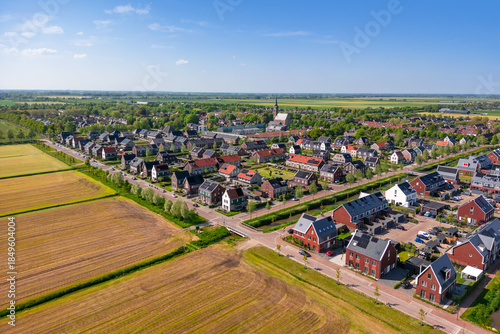 Scenic landscape of Luttelgeest village in the middle of the fields in The Netherlands, established in 1950