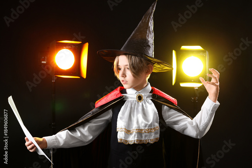 Little actor dressed as mag...
