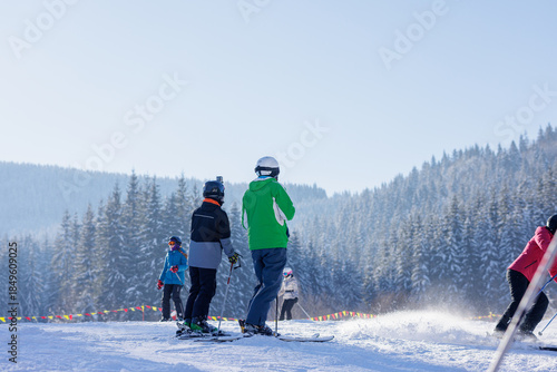 Obraz na plátně Group ski lesson on snowy mountain slope at winter resort