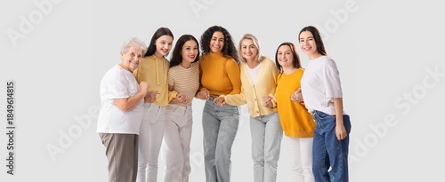 Group of many women holding...