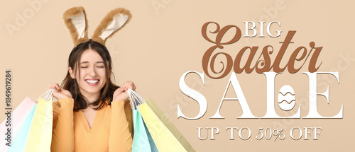 Young woman in bunny ears w...