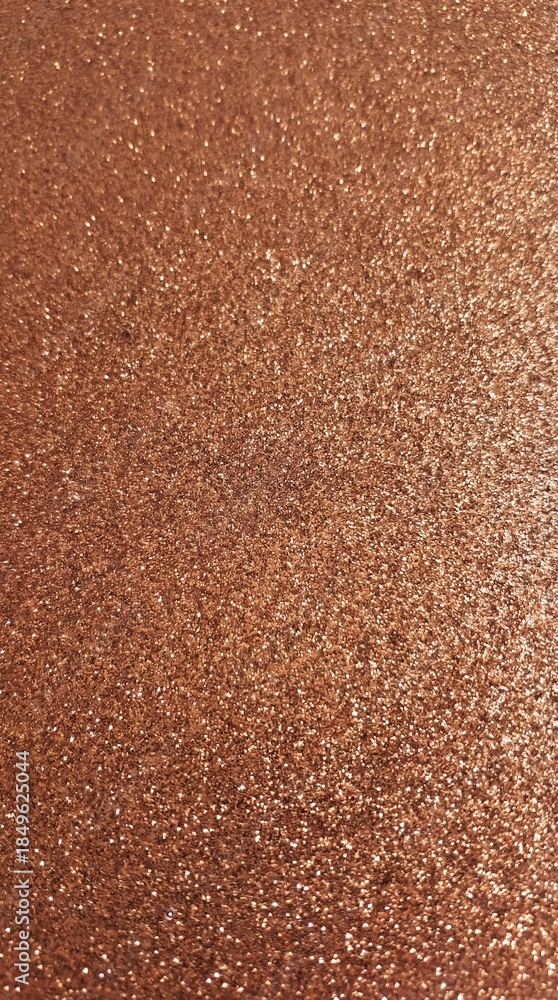 Fototapeta premium Rose gold glitter texture background with dense sparkle and luxury metallic shine