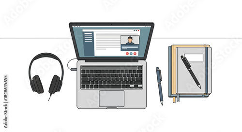 Top view of a laptop with headphones and notebooks on a desk.