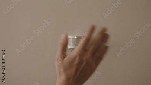 Hand Holding Small White Container Object.