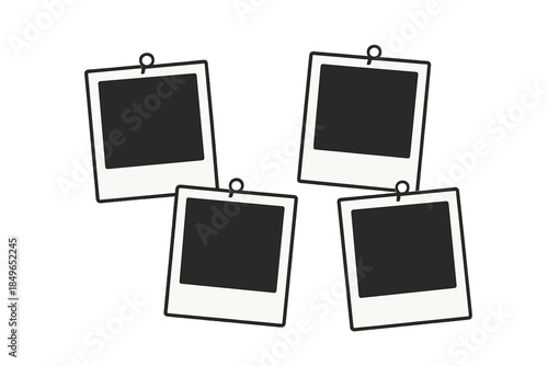 Four empty instant photo frames hanging on a wall