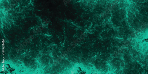 Dark teal abstract background with intense, granular texture and a powerful, energetic feel for dramatic graphic design and abstract art