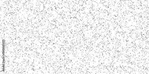 Mosaic-like textured background with irregular grey and black polygonal shapes on a white surface, offering a unique abstract pattern for creative projects