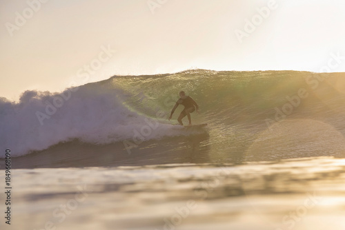 Surfer Inside Barreling Wave Glowing Compressed Light