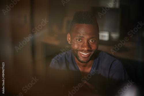 Fotografia Black man, smile and portrait of doctor in hospital for healthcare or medical professional at night