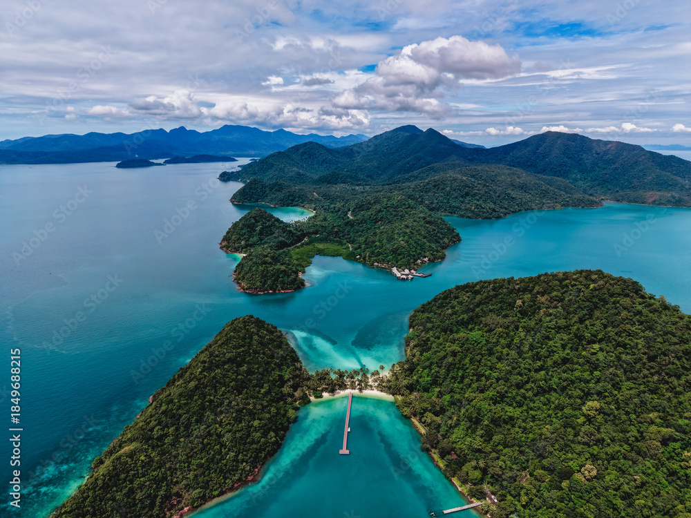 Fototapeta premium Stunning aerial view of Ko Ngam beach, Koh Chang, with lush hills and blue waters