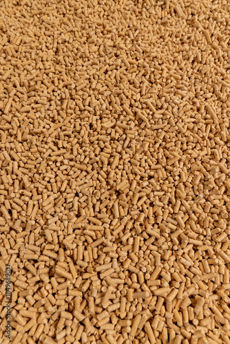 a large number of fuel pellets made from sawdust of coniferous spruce or pine trees, the pellets are used both for indoor heating and for bedding for pets, wood pellets