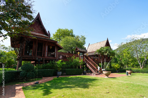 Kanchanaburi, Thailand. December 6, 2025 : Beautiful garden, lake, traditional Thai, Siamese clothes, buildings of 
