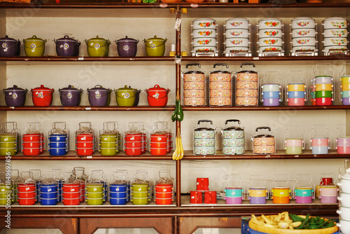 Wallpaper Mural  Lunch box. Colorful metal tiffin food carrier on wood wall. Torontodigital.ca