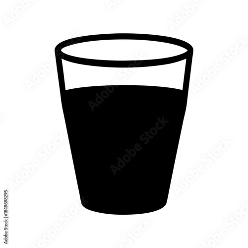 A glass of dark liquid