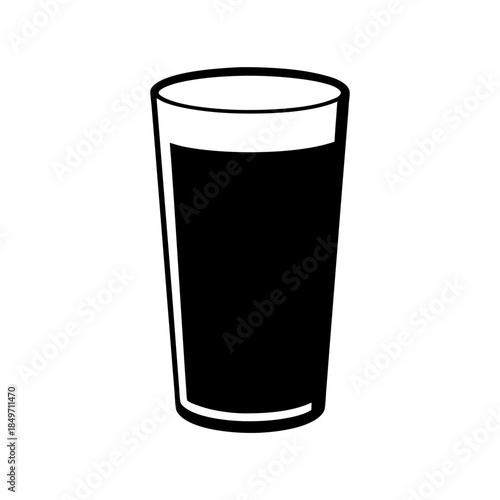 A glass of dark liquid