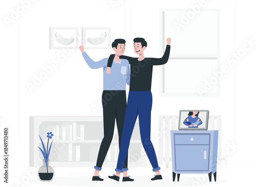 Two men celebrating in a room with a laptop on a cabinet celebration des