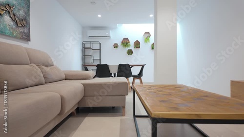 Spacious basement lounge with dining and TV area