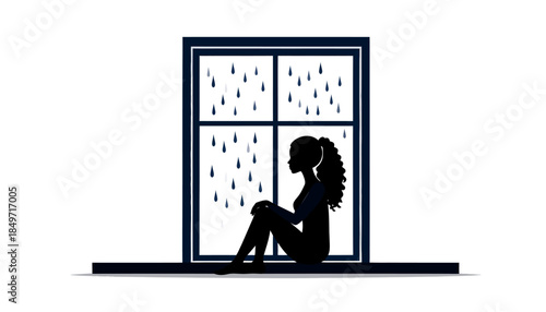 Silhouette of a sad woman sitting by a window on a rainy day, feeling lonely and depressed.