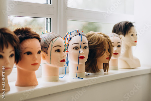 Принти на полотні Training mannequin heads in professional hairdressing classroom.