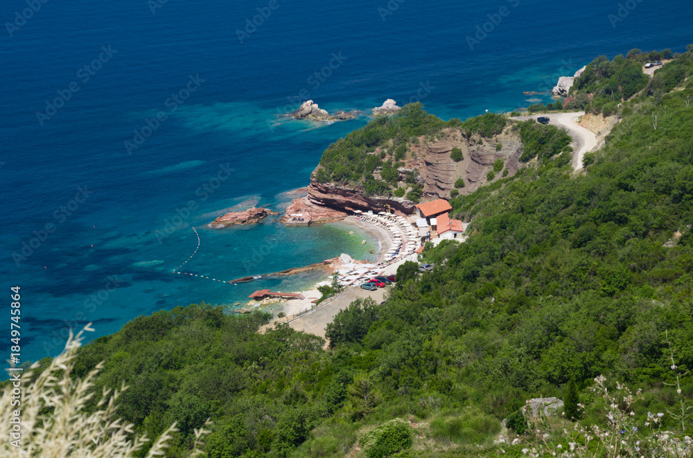 Fototapeta premium Aerial View of Serene Beach with Clear Blue Waters