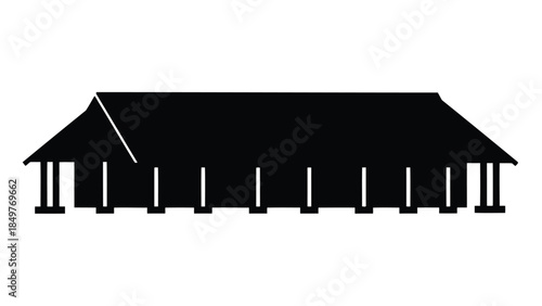 Black silhouette of a long building with a sloping roof and columns isolated on white background