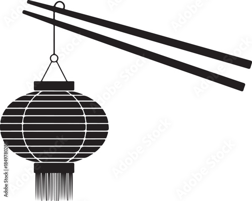 Chinese lantern hanging elegantly from a pair of chopsticks, symbolizing culture and tradition
